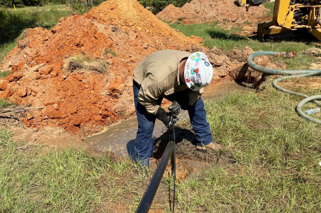 Worker adding in corrosion prevention